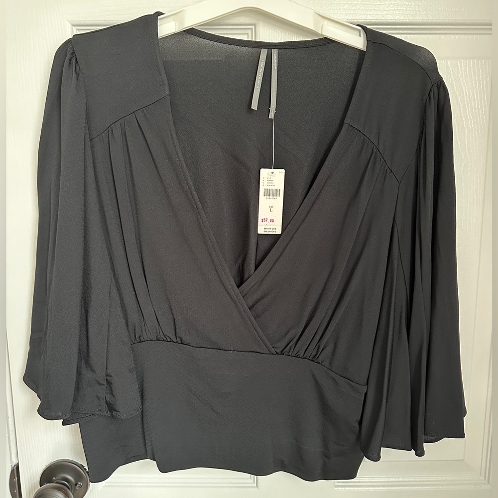 Anthropologie stretchy black top with bell sleeves, L
